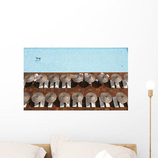 Man Swimming In Pool By Sunloungers, Aerial View Wall Mural