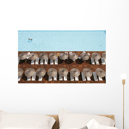 Man Swimming In Pool By Sunloungers, Aerial View Wall Mural