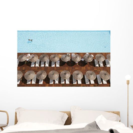 Man Swimming In Pool By Sunloungers, Aerial View Wall Mural