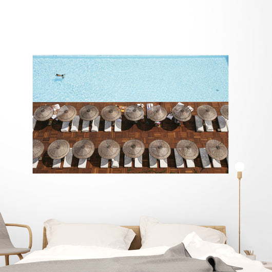 Man Swimming In Pool By Sunloungers, Aerial View Wall Mural