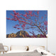 A Tree With Pink Blossoms In Red Rock Country Wall Mural