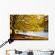 A Large Tree And Bench Along The Water In Autumn Wall Mural