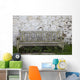 A Wooden Bench With Peeling Paint Against A White Wall Wall Mural