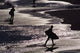 Silhouettes Of Surfers On Beach Wall Mural