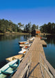 Old Wooden Pier And Boats In Harbor Wall Mural