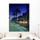 Palm Tree Lined Promenade With People Eating In Restaurants At Dusk Wall Mural