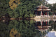 People Resting Under Pagoda On Hoan Kiem Lake Shore Wall Mural