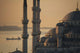 Ship sailing along Bosphorus behind Sultanahmet or Blue mosque at dawn Wall Mural