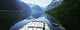 Boat Traveling Through Lavtn Lake Wall Mural