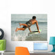 A Man Entering The Water On A Surf Board Off Valdevaqueros Beach Wall Mural