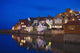 UK, Yorkshire, Houses reflecting in water at dusk Wall Mural