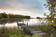 A Dock On A Lake At Sunrise Near Wawa Wall Mural