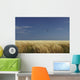 A Swallow Flying Low Over A Barley Field Wall Mural