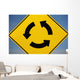 A Yellow Sign Showing Three Arrows Going In A Circle Wall Mural