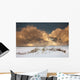 Illuminated Clouds Glowing Above A Snowy Field Wall Mural