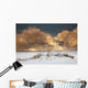 Illuminated Clouds Glowing Above A Snowy Field Wall Mural