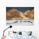 Illuminated Clouds Glowing Above A Snowy Field Wall Mural