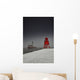 A Red Lighthouse Along The Coast In Winter With A Boat Off The Shore Wall Mural