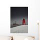 A Red Lighthouse Along The Coast In Winter With A Boat Off The Shore Wall Mural