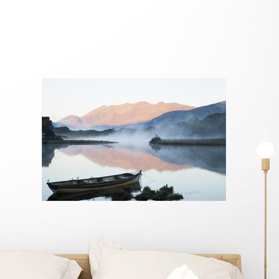 Boat Tranquil Lake Wall Mural shown on a wall