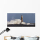 Waves Crashing Against A Lighthouse Wall Mural