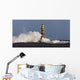 Waves Crashing Against A Lighthouse Wall Mural
