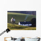 A Sheep Standing On A Hill With A House In The Background Wall Mural