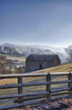 A Barn On A Hilly Landscape In The Fog Wall Mural