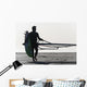 A Man Walking On The Beach Carrying A Kite Surfboard Wall Mural