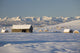 Snow Covered Log Cabin And Hay Bales Wall Mural