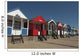 Traditional beach huts on the seafront at Southwold, Suffolk, UK Wall Mural
