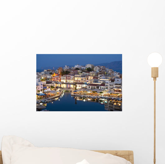 Greece, Crete, View of Lake Vouismeni and town at dusk Wall Mural