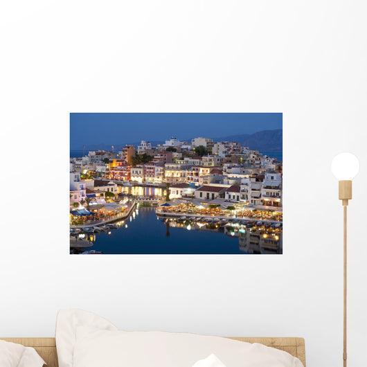 Greece, Crete, View of Lake Vouismeni and town at dusk Wall Mural