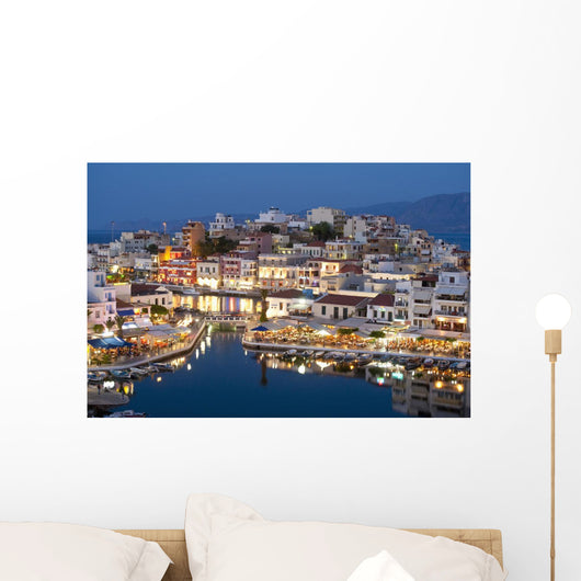 Greece, Crete, View of Lake Vouismeni and town at dusk Wall Mural