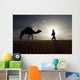 Silhouette Of Berber Leading Camel Across Sand Dunes At Dusk Wall Mural