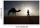 Silhouette Of Berber Leading Camel Across Sand Dunes At Dusk Wall Mural