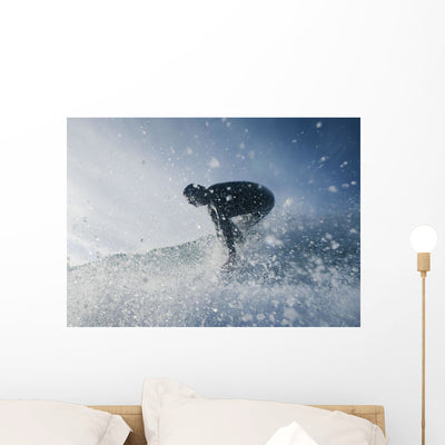 Man Surfing off Bunker Wall Mural shown on a wall