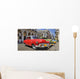 Havana street with colorful old cars in a raw Wall Mural