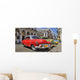 Havana street with colorful old cars in a raw Wall Mural