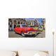 Havana street with colorful old cars in a raw Wall Mural