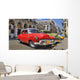 Havana street with colorful old cars in a raw Wall Mural