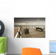 A Wooden Pier With Benches Looking Out Over The Beach And Water Wall Mural