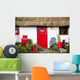 Traditional Irish Cottage With A Red Door And Red Decorative Items Wall Mural