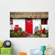 Traditional Irish Cottage With A Red Door And Red Decorative Items Wall Mural