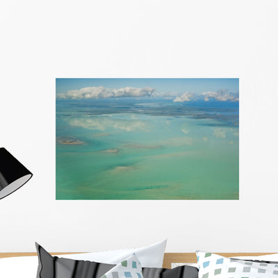Ocean and Clouds Sky Wall Mural shown on a wall