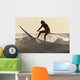 A Surfer Paddling On A Surfboard Off Benavides Beach Wall Mural