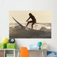 A Surfer Paddling On A Surfboard Off Benavides Beach Wall Mural