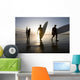 Silhouette Of Three Surfers Carrying Surfboards Wall Mural