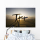 Silhouette Of Three Surfers Carrying Surfboards Wall Mural