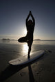 Silhouette Of Female Surfer Doing Yoga Tree Pose Wall Mural